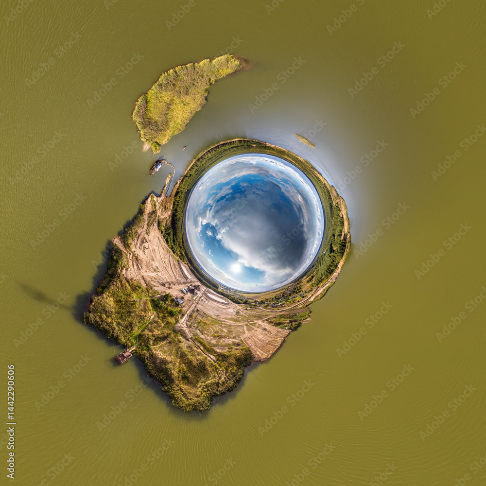 blue hole sphere or globe little planet inside grass or sand or dry ground frame background with tractor tracks