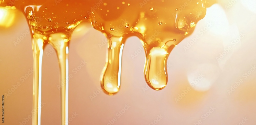 Golden honey dripping, close-up shot showing texture and flow.