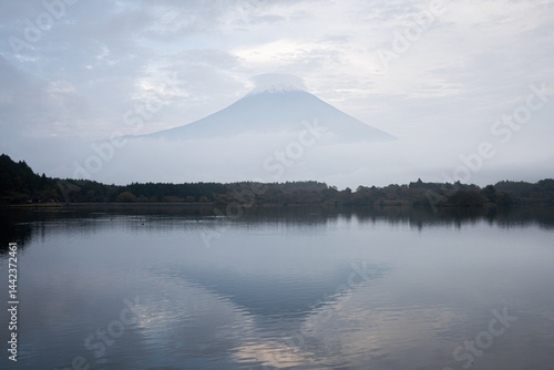 View of Tanuki lake with maple trees in the evening