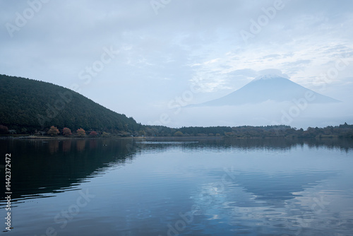 View of Tanuki lake with maple trees in the evening