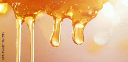 Obraz na płótnie Golden honey dripping, close-up shot showing texture and flow. w salonie