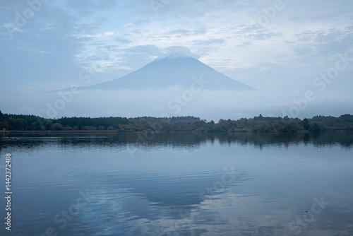 View of Tanuki lake with maple trees in the evening