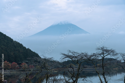 View of Tanuki lake with maple trees in the evening
