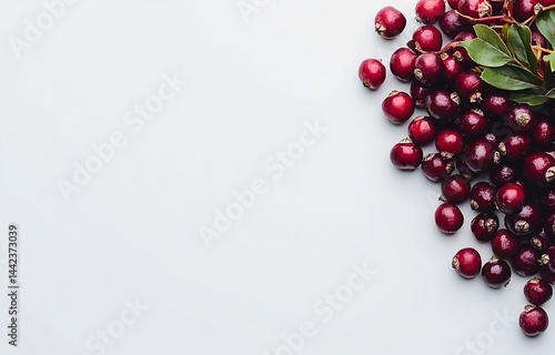 Obraz na płótnie Fresh cranberries scattered on a white background, leaving copy space. w salonie