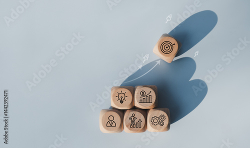 Rocket launching from wood cube with business icon, Start-up, Creativity, Big idea, Business goals management, Investment on new project to wealth, Company strategy target, Sustainable financial plan