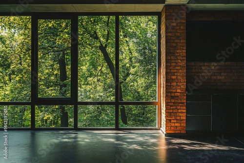 Obraz na płótnie Sunlit interior space with large windows showcasing lush green trees. w salonie