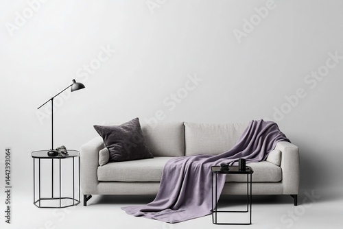 Obraz na płótnie Minimalist living room interior with beige sofa, purple throw, and side tables against a white wall. w salonie