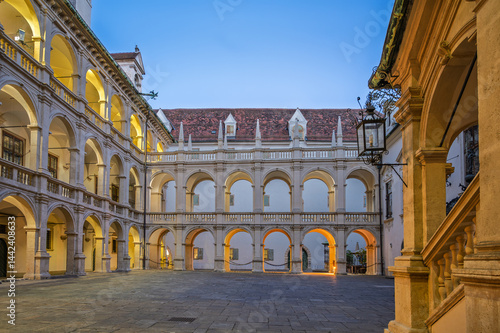 Relaxing evening in a historic courtyard in Graz Austria with charming architecture and beautiful arches