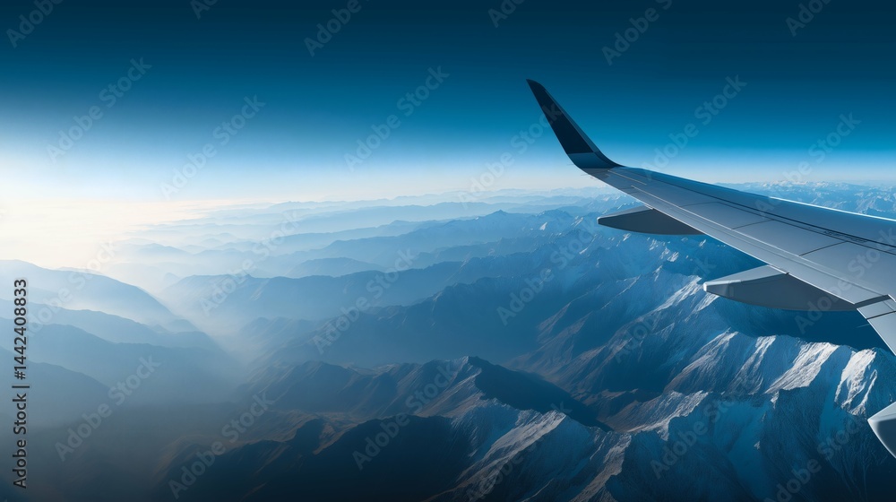 Airplane wing above scenic mountain view, Aerial shot from aircraft window seat, Concept of travel, freedom or adventure inspiration
