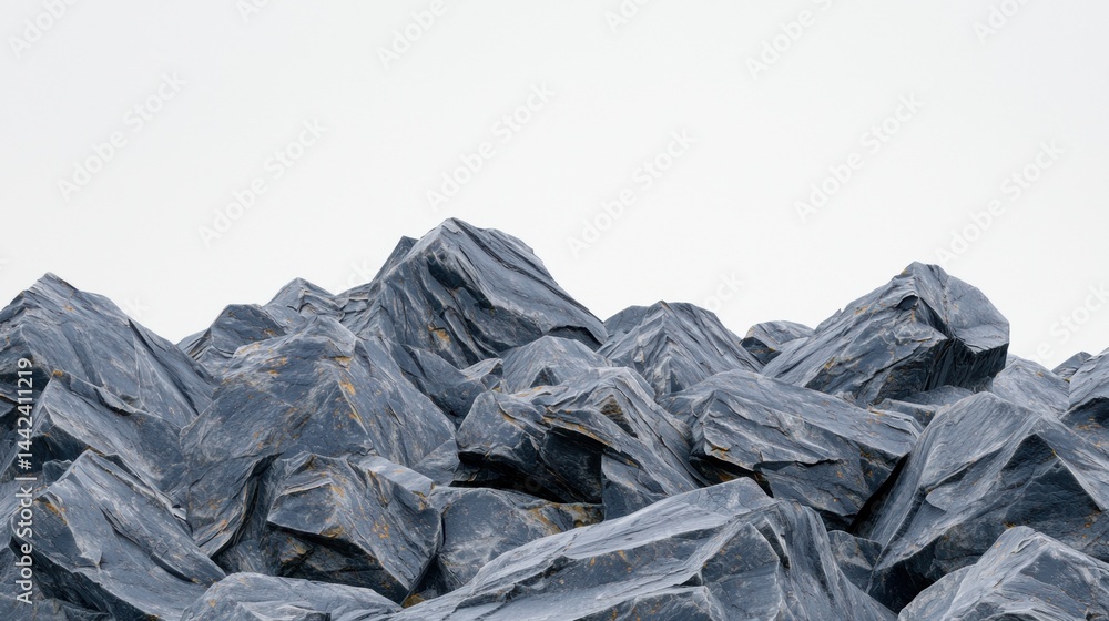 A pile of rocks with a rough texture and varying shades of gray.