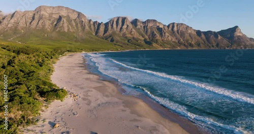 Spectacular aerial view of unspoilt beaches and a majestic mountain range in Cape Town’s stunning coastal landscape, popular tourist destination in South Africa