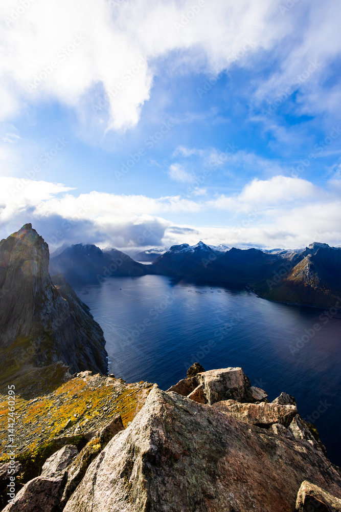 Stunning autumn landscape of Segla Mountain in Senja Island, Northern Norway, with dramatic cliffs and fjords.