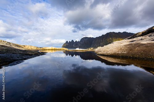 Obraz na płótnie Autumn landscape of Senja Island in Northern Norway with colorful foliage, mountains, and a serene fjord. w salonie