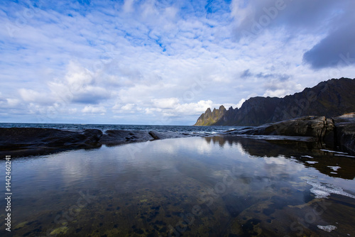 Obraz na płótnie Autumn landscape of Senja Island in Northern Norway with colorful foliage, mountains, and a serene fjord. w salonie