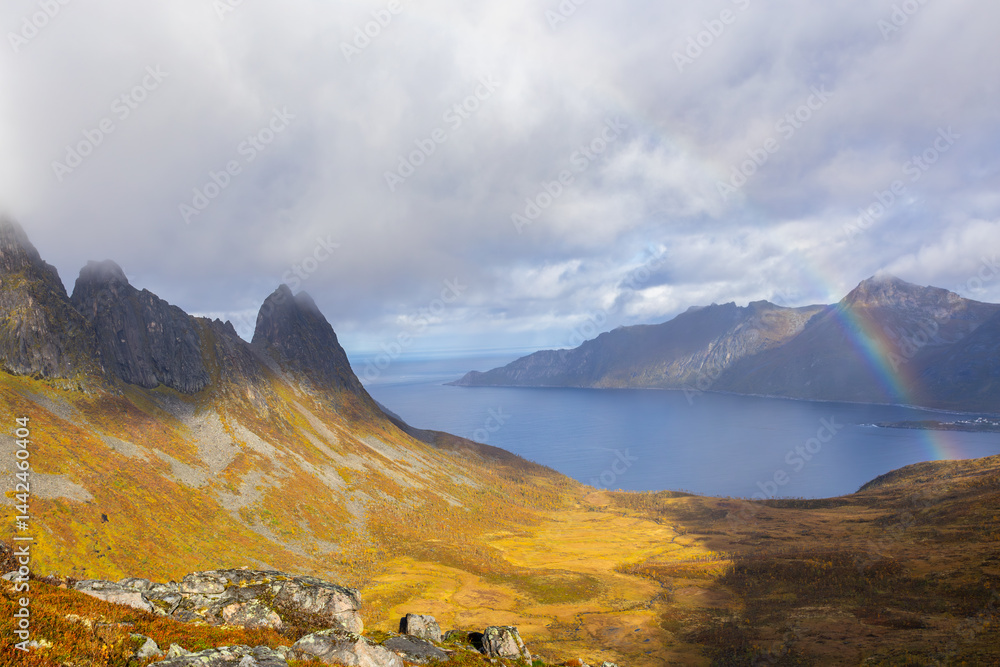 Stunning autumn landscape of Segla Mountain in Senja Island, Northern Norway, with dramatic cliffs and fjords.