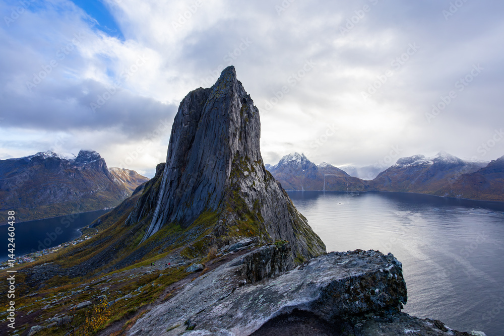 Stunning autumn landscape of Segla Mountain in Senja Island, Northern Norway, with dramatic cliffs and fjords.