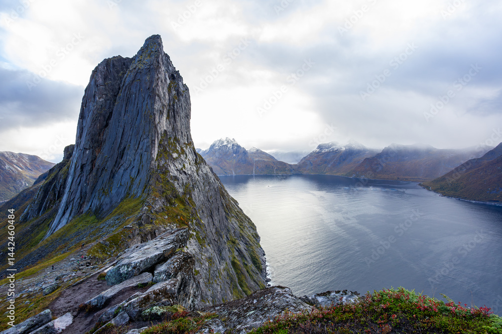 Stunning autumn landscape of Segla Mountain in Senja Island, Northern Norway, with dramatic cliffs and fjords.