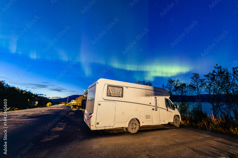Motorhome and northern lights in Kiruna, Sweden.