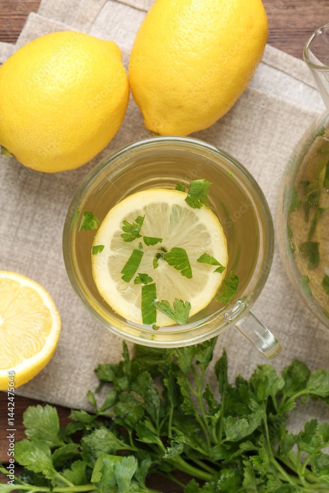 Healthy parsley tea with lemon slices on table, flat lay. Detox drink Healthy parsley tea with lemon slices on table, flat lay. Detox drink