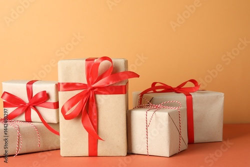 Wallpaper Mural Many gift boxes wrapped in kraft paper on orange table Torontodigital.ca