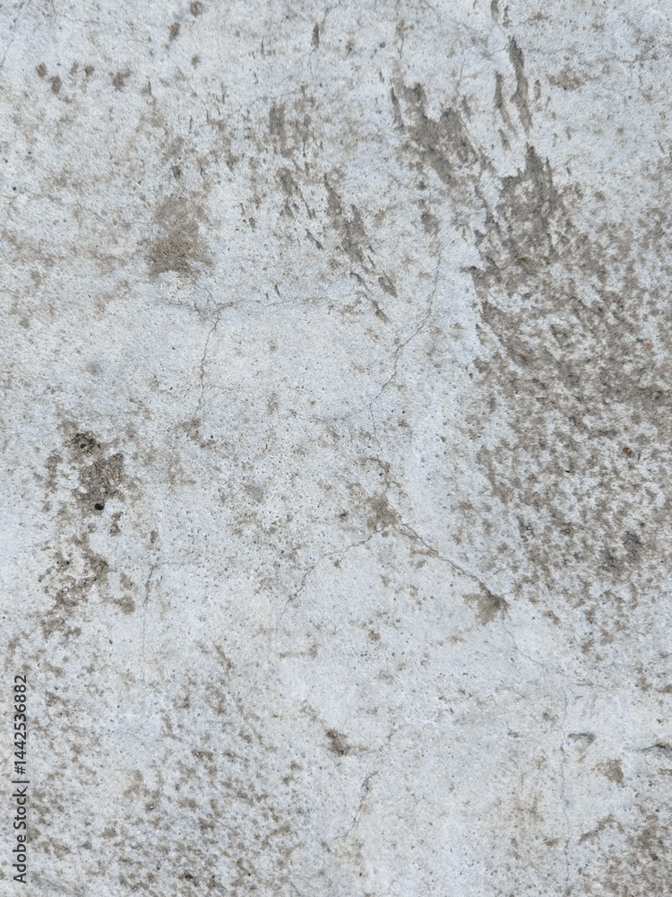 Close-up of a rough and weathered concrete surface with cracks and imperfections Close-up of a rough and weathered concrete surface with cracks and imperfections