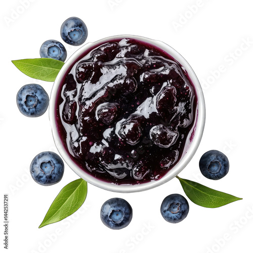 Overhead view of blueberry jam in a bowl with fresh blueberries around it