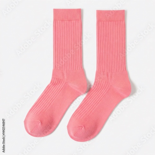 A pair of pink men's ribbed cotton socks isolated on white background. Textured long socks close-up