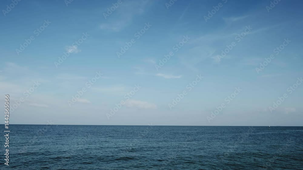 Ocean horizon and sunny blue sky with calm waves. Tranquil beauty of the sea. Ocean horizon and sunny blue sky with calm waves. Tranquil beauty of the sea.