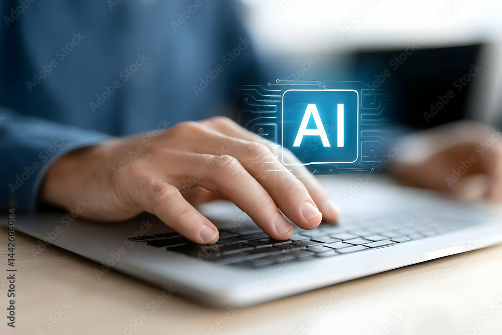 A close-up of a person's hand typing on a laptop keyboard with a glowing AI symbol, representing artificial intelligence in modern computing. A close-up of a person's hand typing on a laptop keyboard with a glowing AI symbol, representing artificial intelligence in modern computing.