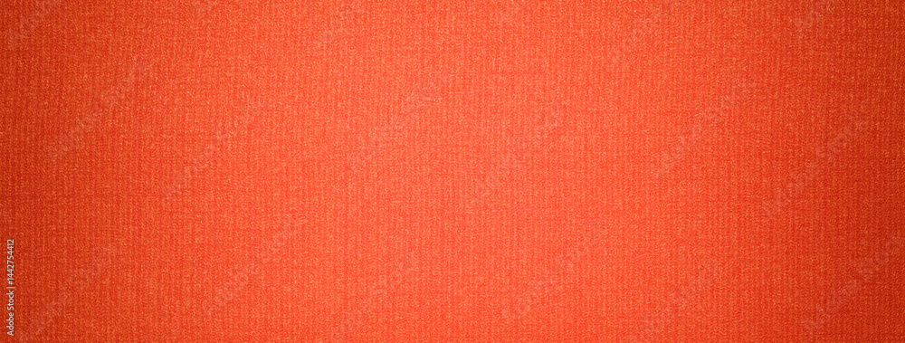 Fototapeta premium Dark orange and brick background from textile material with wicker pattern with vignette. macro.