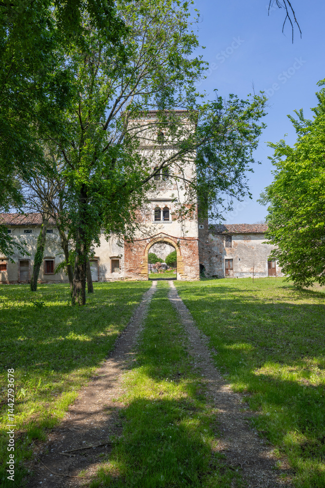 Exploring the historic Castello di Pojana Maggiore in Veneto, Italy, during a sunny spring day