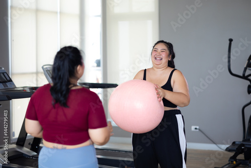 Obraz na płótnie gymnastic ball. beautiful young chubby overweight woman in sportswear doing exercise indoors at gym fitness sport club, body and health care w salonie