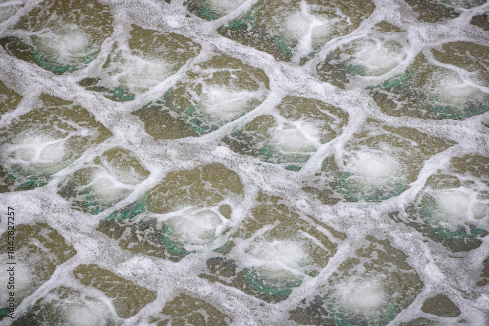 Biological treatment process in aeration basin closeup. Specialized equipment serves for breakdown of organic pollutants by infusion of oxygen