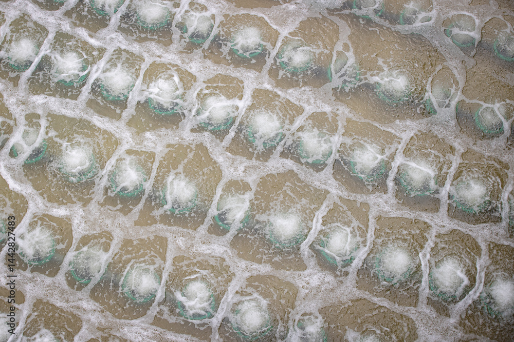 Biological treatment process in aeration basin closeup. Specialized equipment serves for breakdown of organic pollutants by infusion of oxygen