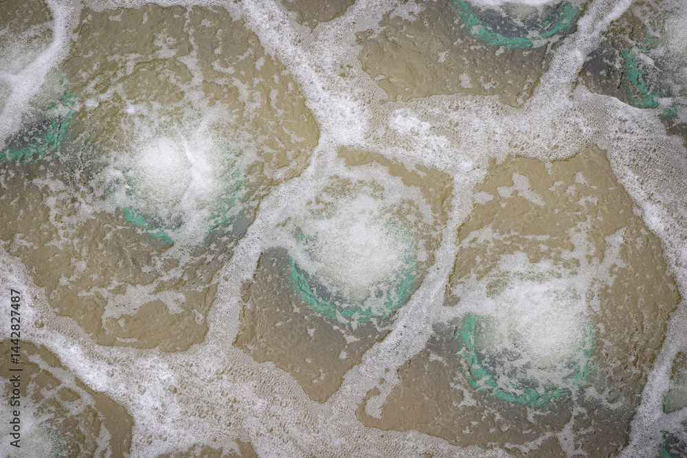 Biological treatment process in aeration basin closeup. Specialized equipment serves for breakdown of organic pollutants by infusion of oxygen