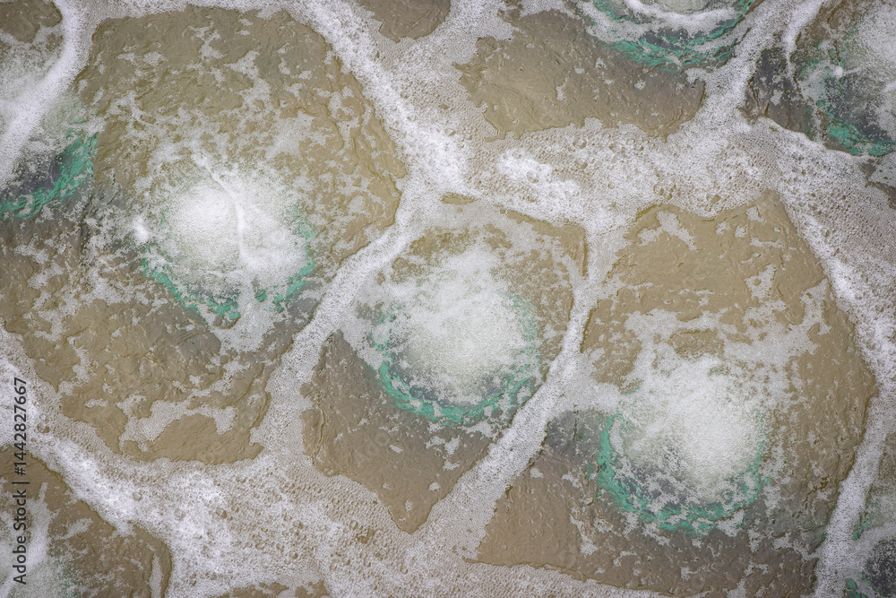 Biological treatment process in aeration basin closeup. Specialized equipment serves for breakdown of organic pollutants by infusion of oxygen
