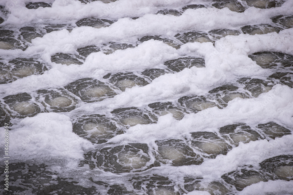 Biological treatment process in aeration basin closeup. Specialized equipment serves for breakdown of organic pollutants by infusion of oxygen