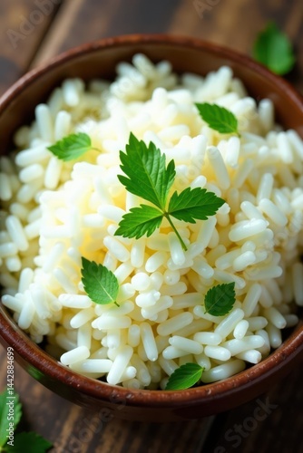 Fluffy white rice, scattered herb leaves atop, close up shot, aromatic