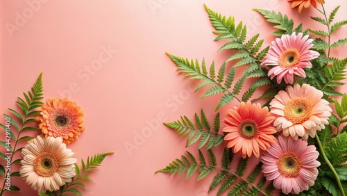 Floral Arrangement with Peach and Pink Gerbera Daisies and Fern Greenery on a Soft Pink Background