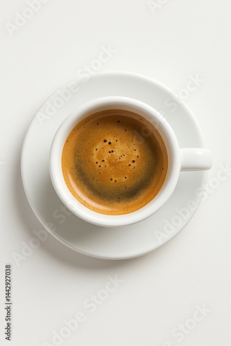 Coffee Served in a White Cup With Crema on Top Against a Plain Background