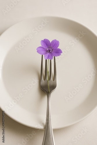 Unique Culinary Art With Flower on Fork Placed on Plate for Creative Dining Experience
