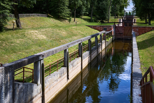 Photos Sluice water channel containing sluice gate, type of lock to manage the water flow and water level