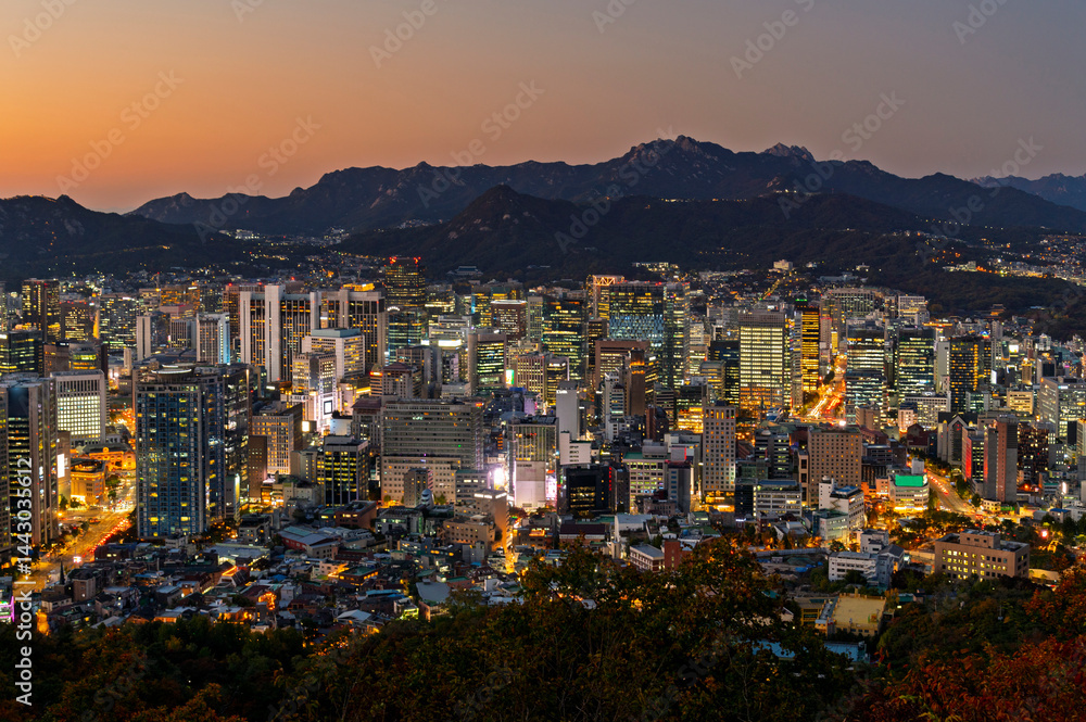 Gold sun risae or sunset of Seoul cityscapes with high rise office buildings and skyscrapers in Seoul city, Republic of Korea in winter season