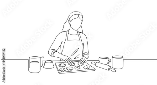 Woman Baking Cookies on a Table with Baking Ingredients  