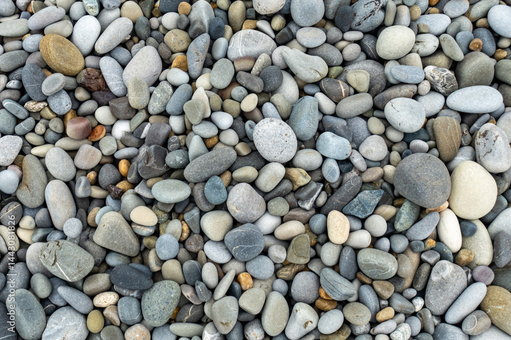 A pile of rocks with a single rock in the middle A pile of rocks with a single rock in the middle