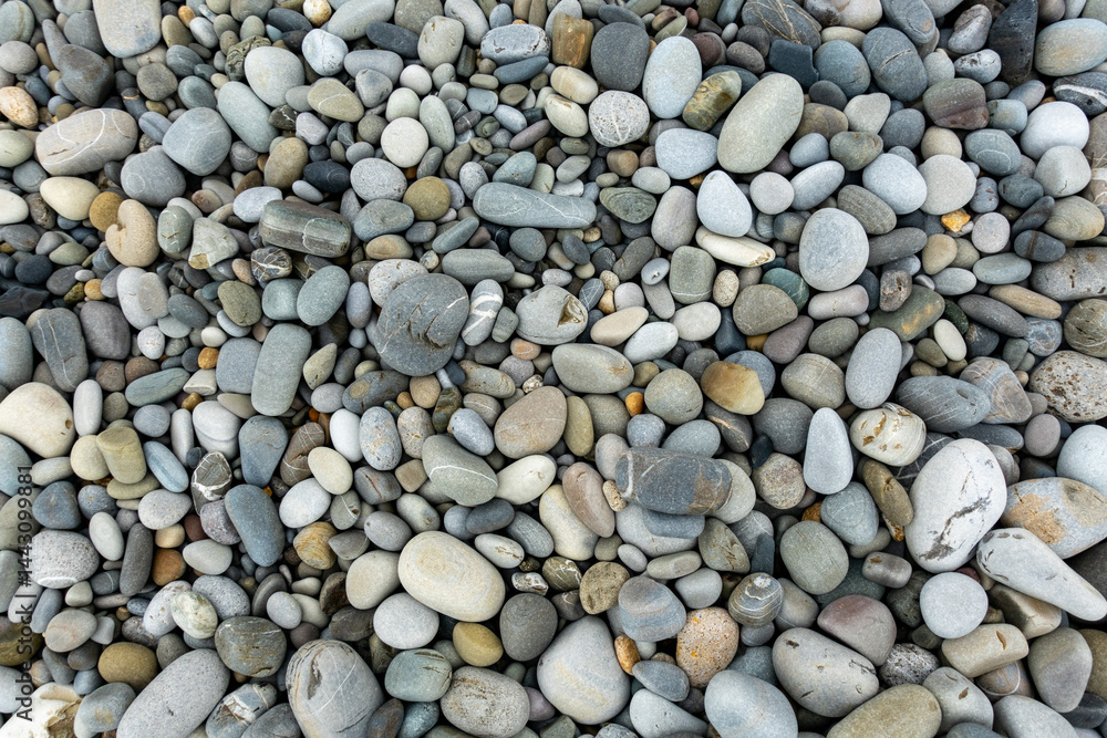 A pile of rocks with a single rock in the middle A pile of rocks with a single rock in the middle