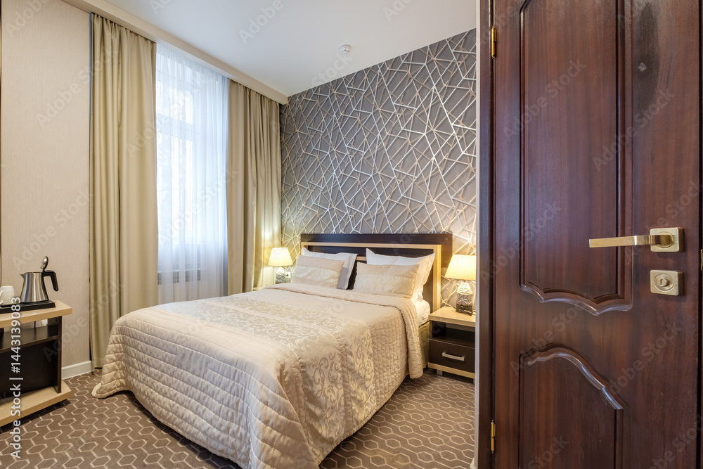 Interior of modern luxure bedroom in studio apartments with double bed with pillows
