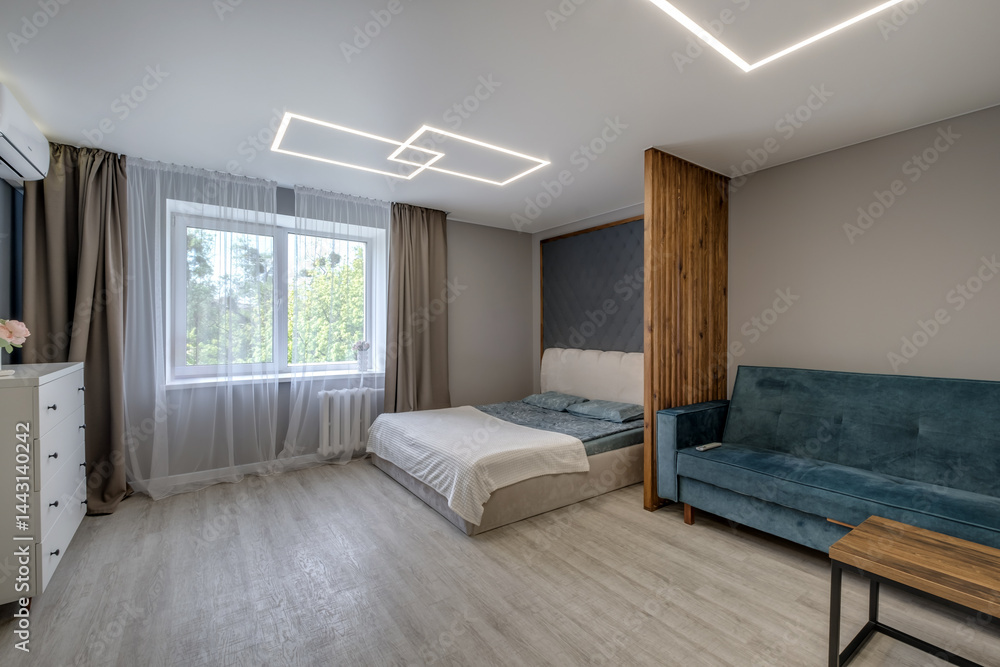 Interior of modern luxure bedroom in studio apartments with double bed with pillows