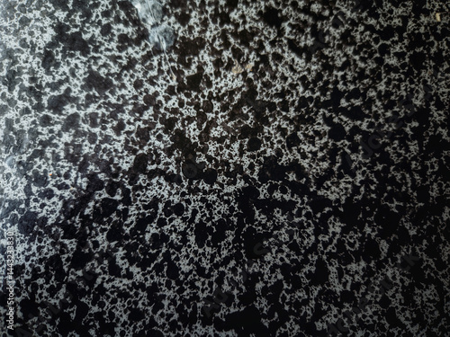 Abstract Texture: A close-up shot showcasing a textured surface, with a mesmerizing display of mottled patterns, offering a unique backdrop for various creative projects.