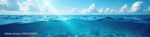 Deep blue ocean, cloudy sky above, vibrant underwater world, fish, beautiful, photo